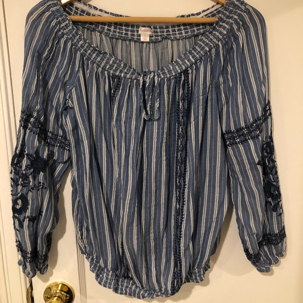 Blue long sleeved shirt.
